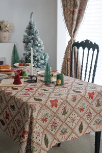 Close-up of Christmas tablecloth featuring festive holiday motifs and jacquard fabric texture