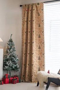 Detailed view of beige Christmas curtain featuring gingerbread man and tree patterns