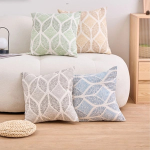 Modern set of 4 geometric leaf pattern decorative cushion covers in green, yellow, and blue