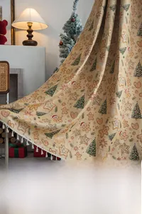 Close-up of festive Christmas gingerbread man jacquard fabric with white tassels