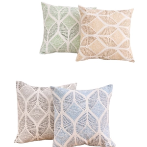 Set of 4 geometric leaf pattern pillow covers in green, yellow, gray, and blue tones