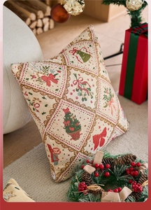 Dettaglio dei motivi dell'albero di Natale e del fiocco rosso su tessuto jacquard di lusso