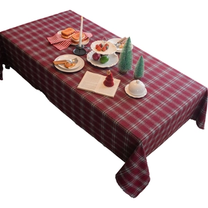 Thick red and white checkered tablecloth with fringe edge for Christmas dining table decoration