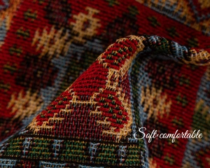 Macro shot of ethnic geometric jacquard fabric with thick texture and colorful weave
