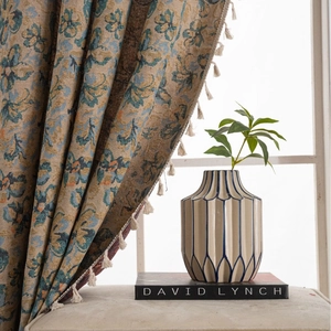 Mid-century vintage floral jacquard curtains with tassels and a ceramic vase decor