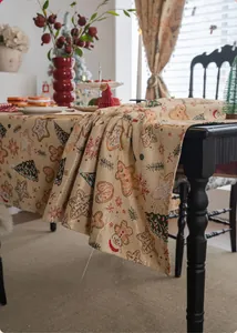 Detailed view of Christmas table runner featuring gingerbread men and festive patterns