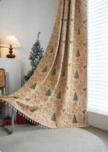 Detail of Christmas gingerbread man curtains with green trees and festive white tassels