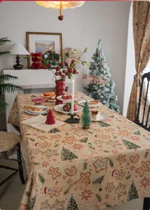 Close-up of Jacquard Christmas tablecloth featuring gingerbread man and snowflake patterns