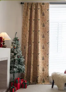 Detailed texture of Christmas gingerbread man curtain with decorative beige pompom fringe