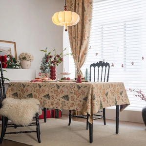 Detail of Christmas tablecloth with gingerbread man, tree and snowflake jacquard texture