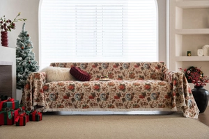 Detailed texture of Christmas jacquard sofa cover with tassels and vintage festive patterns