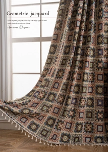 Detail of geometric jacquard fabric with elegant white tassels and multi-color texture