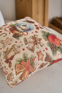 Dettaglio del cuscino jacquard natalizio con omino di pan di zenzero e ricamo festivo