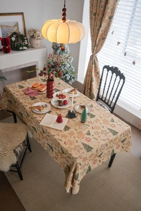 Close-up of Christmas tablecloth featuring gingerbread man patterns and thick fabric texture