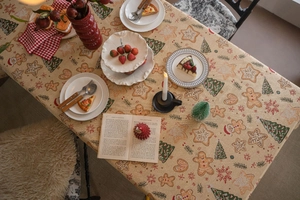 Detailed texture of Christmas tablecloth with gingerbread man and festive patterns