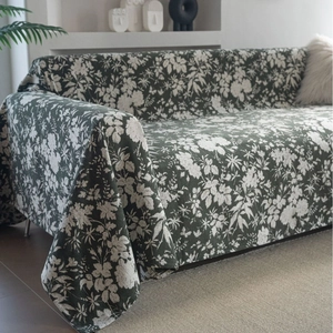 Floral dark green jacquard sofa cover with white botanical pattern in modern rustic style