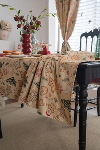Close-up of jacquard gingerbread man pattern on festive Christmas tablecloth fabric
