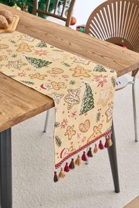 Detailansicht des Weihnachtstischläufers mit Lebkuchenmann-Jacquard und Quastenverzierung