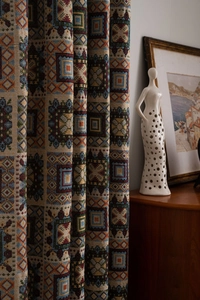 Detailed view of woven curtain with colorful geometric ethnic patterns and thick texture