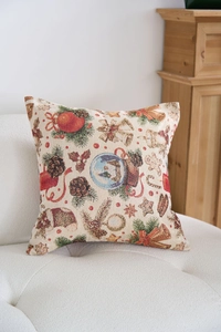 Dettaglio del cuscino natalizio jacquard con motivi di campane e omini di pan di zenzero