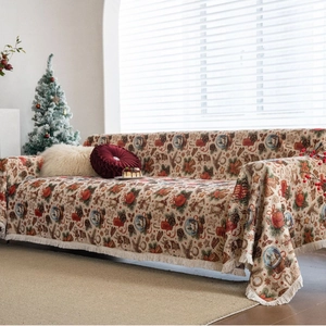 Christmas themed sofa throw with festive ball pattern and elegant white tassels