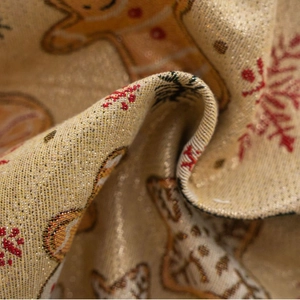 Champagne jacquard curtain fabric with red gingerbread man and snowflake festive patterns