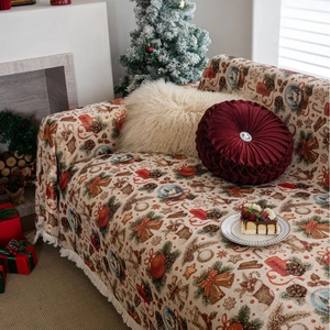 Christmas themed sofa throw with festive jacquard pattern and elegant white tassels