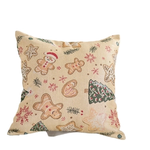 Cuscino decorativo natalizio in jacquard con motivi festivi su tessuto color crema
