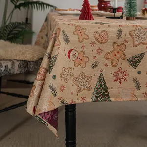 Jacquard Christmas tablecloth with gingerbread man and snowflake patterns in beige gold