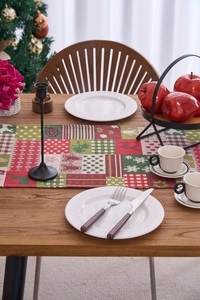 Detailed texture of Christmas table runner with reindeer motifs and festive holiday patterns