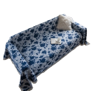 Blue floral jacquard sofa throw cover with cotton fringe tassels and heavy fabric texture