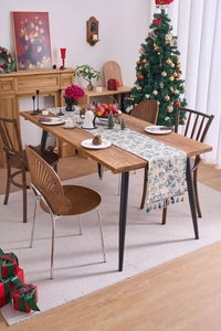 Close-up of Nordic jacquard table runner with vintage floral patterns and colorful tassels