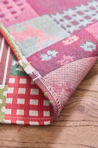 Close-up of thick jacquard woven Christmas table runner with festive patterns and textures