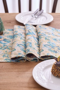 Close-up of jacquard table runner fabric with classic blue and orange floral patterns