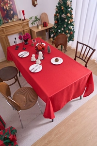 Close-up of red festive tablecloth featuring high-quality woven texture for Christmas dining