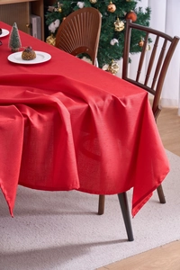 Close-up of red Christmas tablecloth featuring high-quality linen texture and fabric details