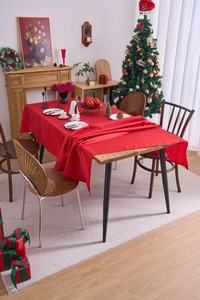 Close-up of red festive tablecloth for Christmas and New Year home dining decoration