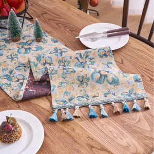 Blue Nordic jacquard table runner with yellow floral patterns and decorative tassels