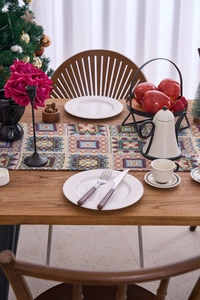 Detailed close-up of geometric jacquard patterns on festive retro table runner fabric