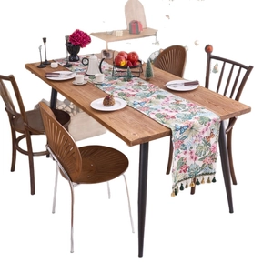 Nordic table runner with pink floral and blue butterfly patterns and green tassels