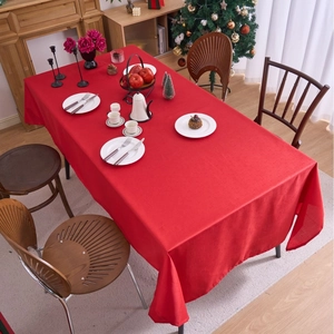 Festive red rectangular waterproof tablecloth with textured fabric for holiday dining decor