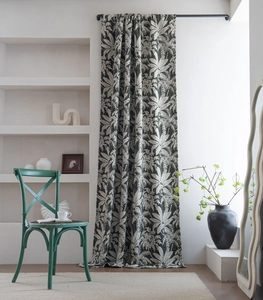 Detailed view of dark green chenille curtains with tropical leaf jacquard pattern