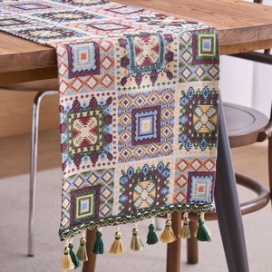 Bohemian jacquard table runner with colorful geometric patterns and decorative tassels