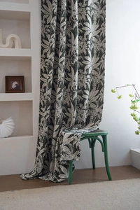 Close-up of dark green chenille jacquard curtain fabric with white palm leaf pattern