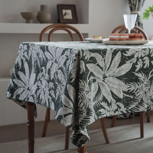 European vintage emerald green tablecloth with tropical white leaf patterns and thick texture