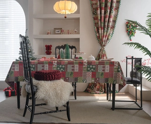 Cozy festive dining scene with Christmas gingerbread man pattern tablecloth and curtains