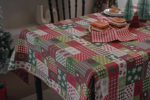Detailed texture of Christmas gingerbread patchwork tablecloth with festive patterns