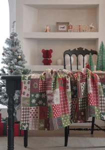 Detailed weave of Christmas table runner with festive elk and snowflake jacquard patterns