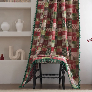 Christmas themed patchwork curtain with reindeer patterns and green tassel edge decoration