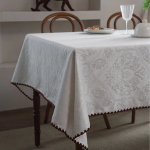 Elegant white floral jacquard tablecloth with vintage brown crochet wavy edges